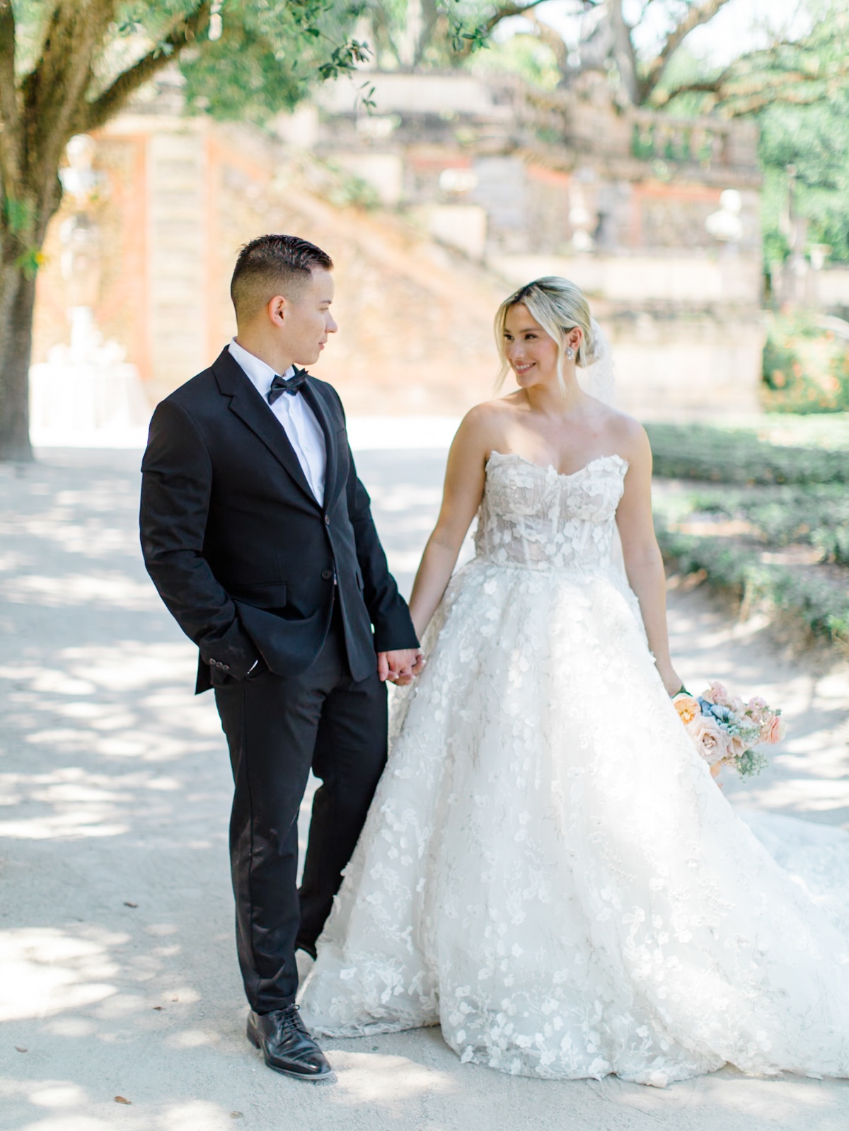 bride in lace gown for garden wedding at vizcaya