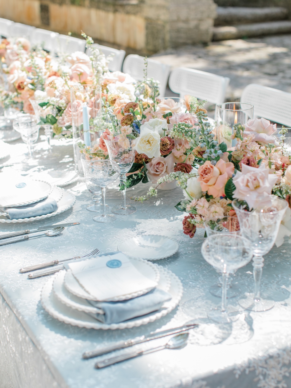 blue and peach wedding reception tablescape