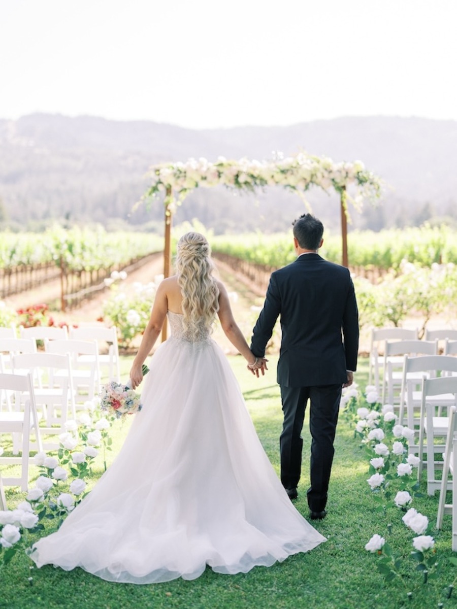 The bride designed her gown for this vineyard wedding in napa