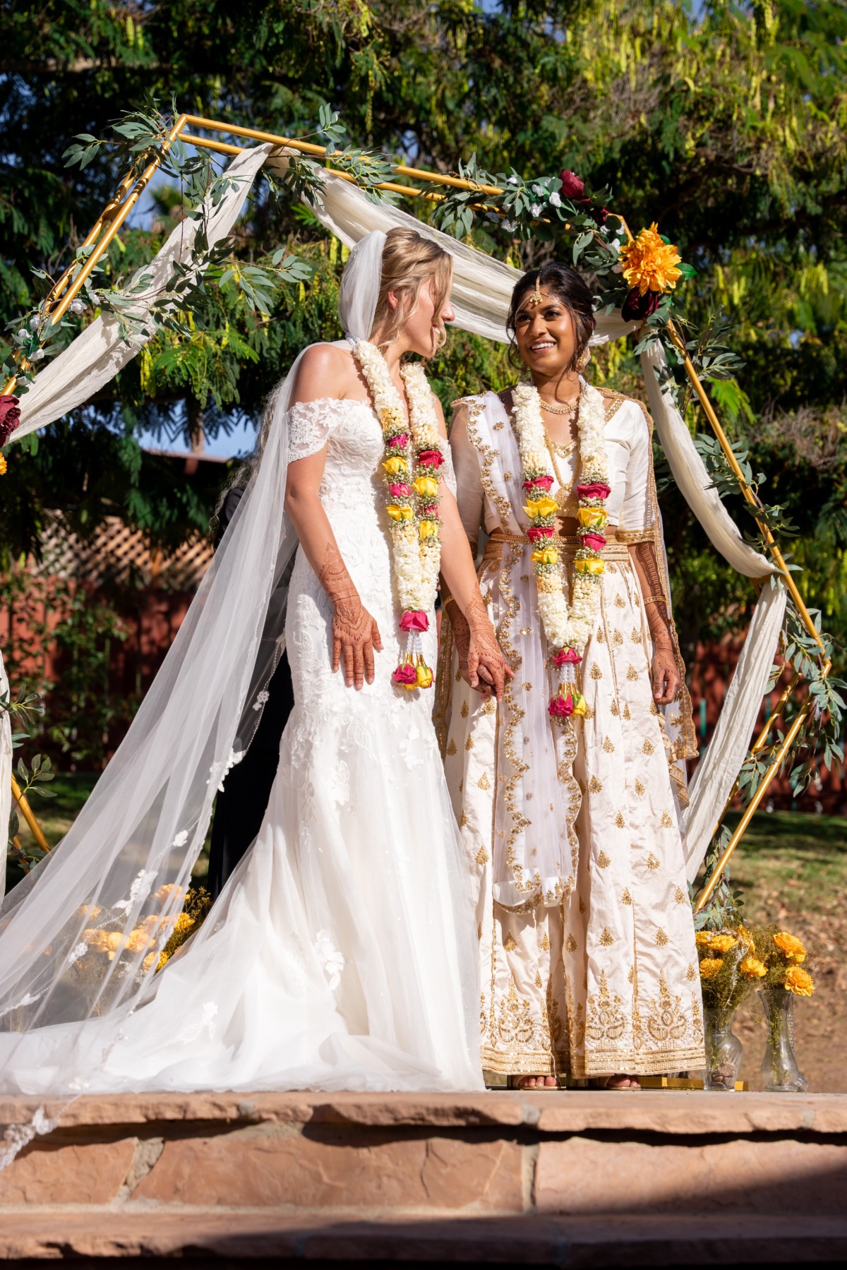 indian and western wedding ceremony with two brides