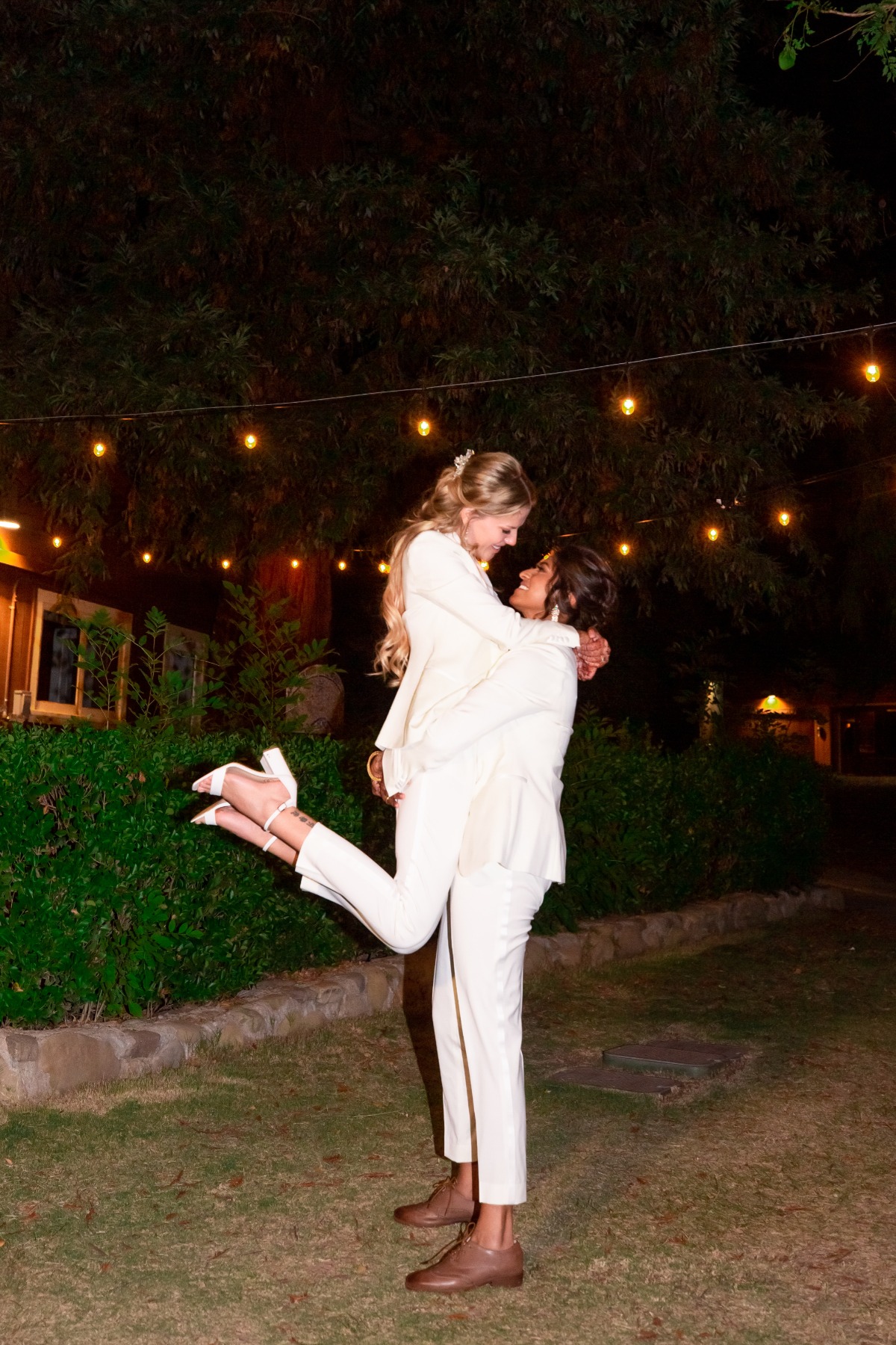 brides in white suits