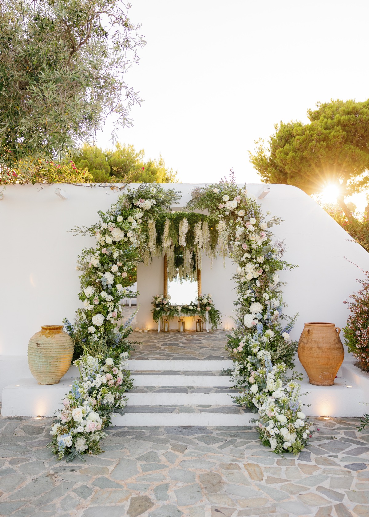 white and greenery floral doorway installation