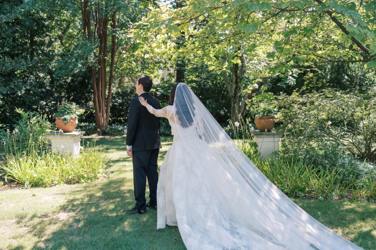 first look in a garden for wedding 