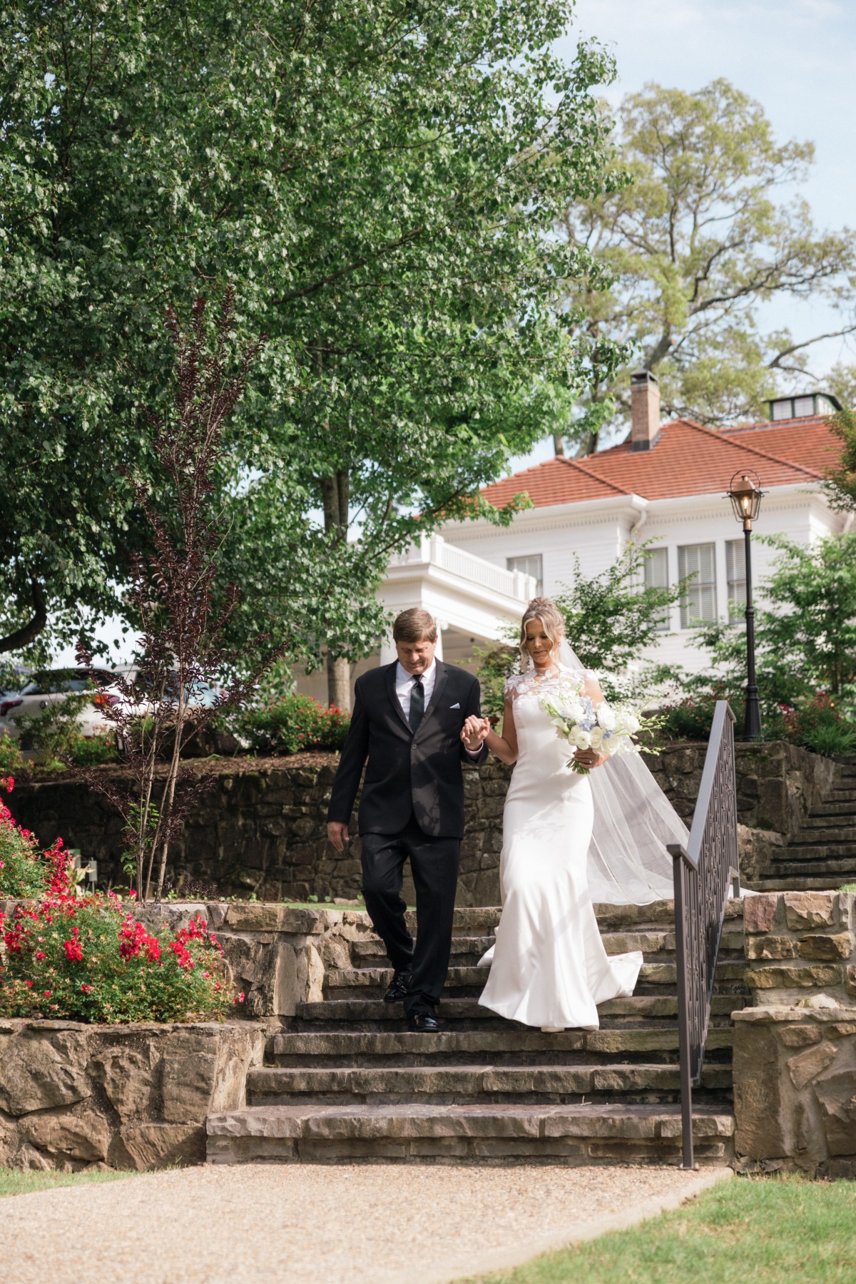 father walking bride down the aisle at southern mansion