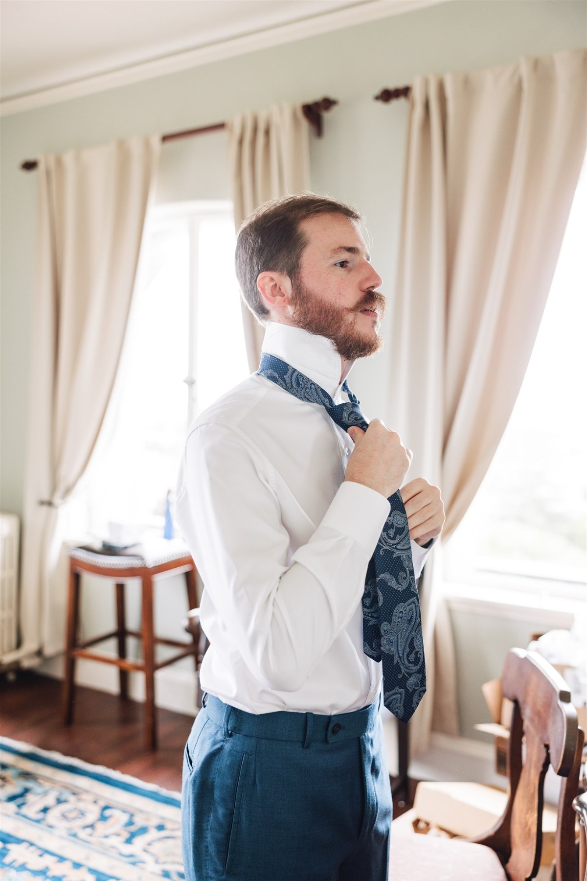 groom in paisley tie