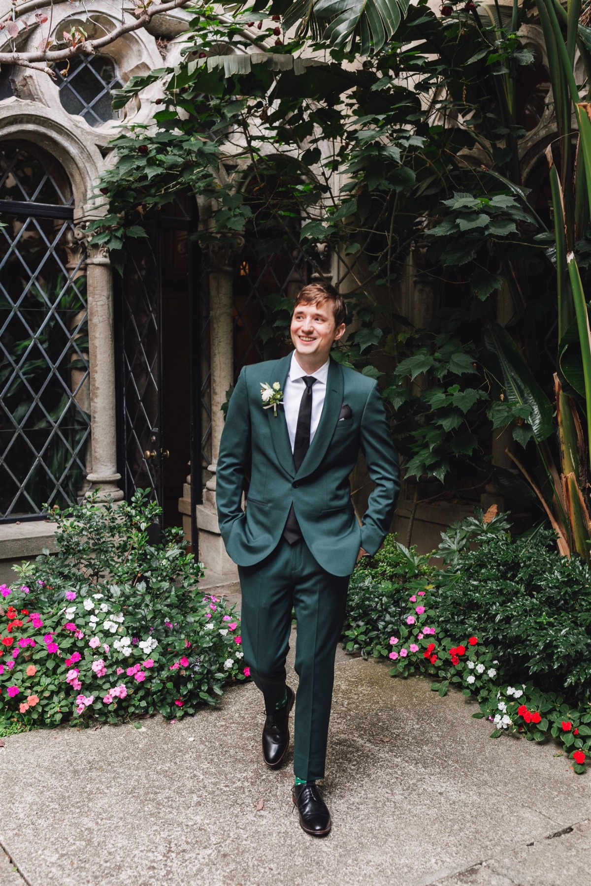 groom in green suit