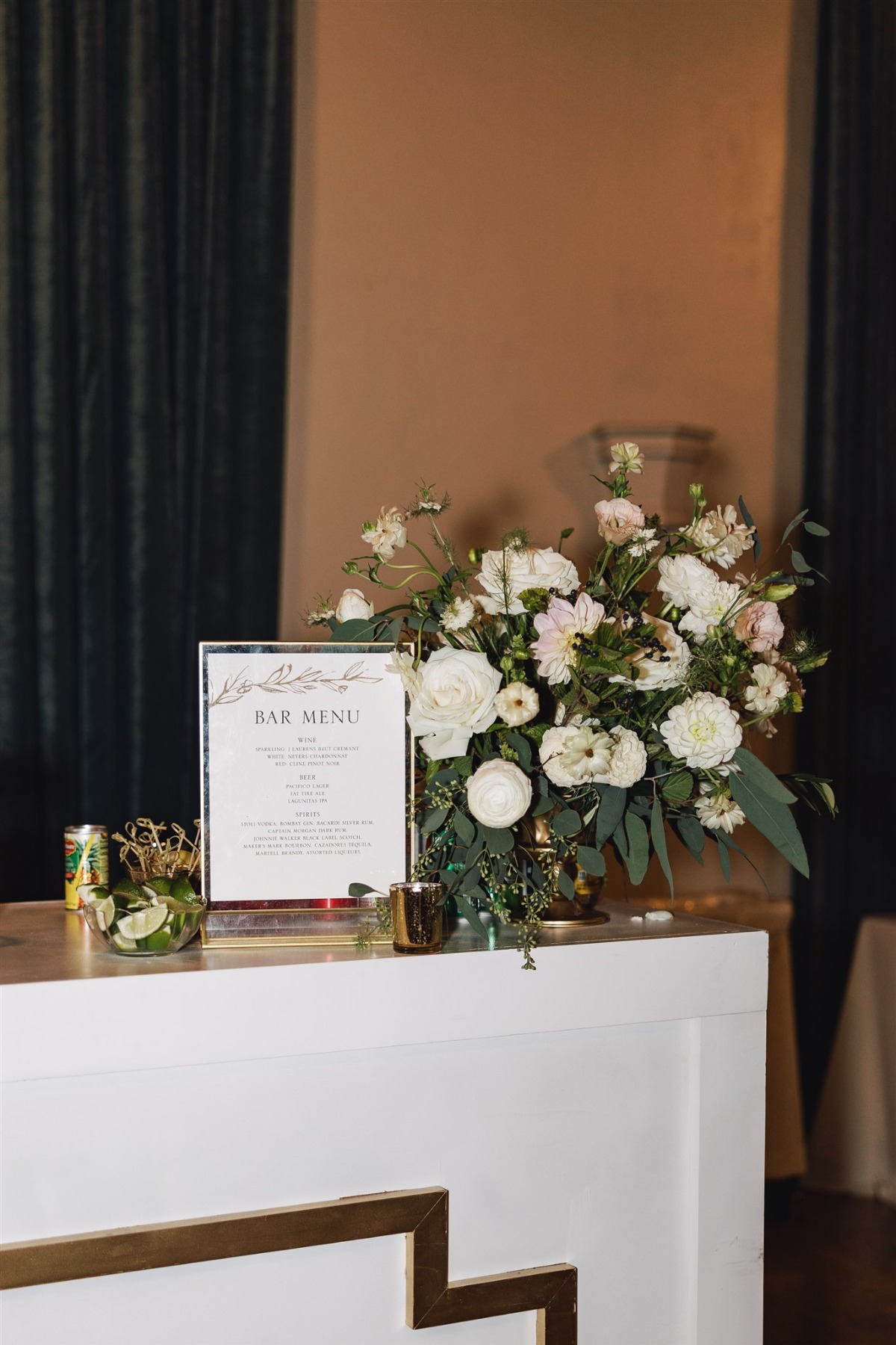 simple white and gold wedding bar setup