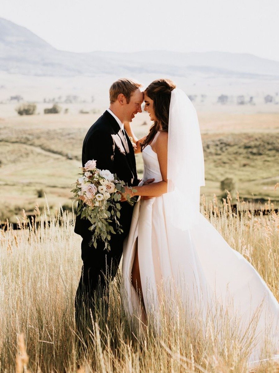 Western-inspired wedding in the mountains with a horseback welcome