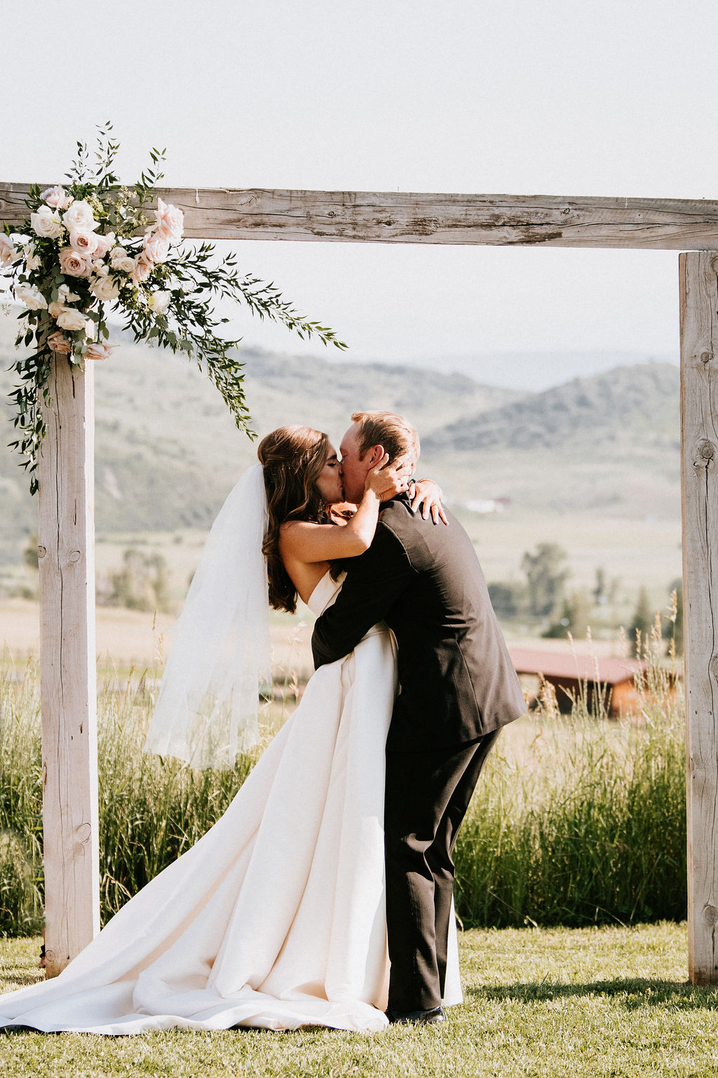 birch wedding arch with blush florals