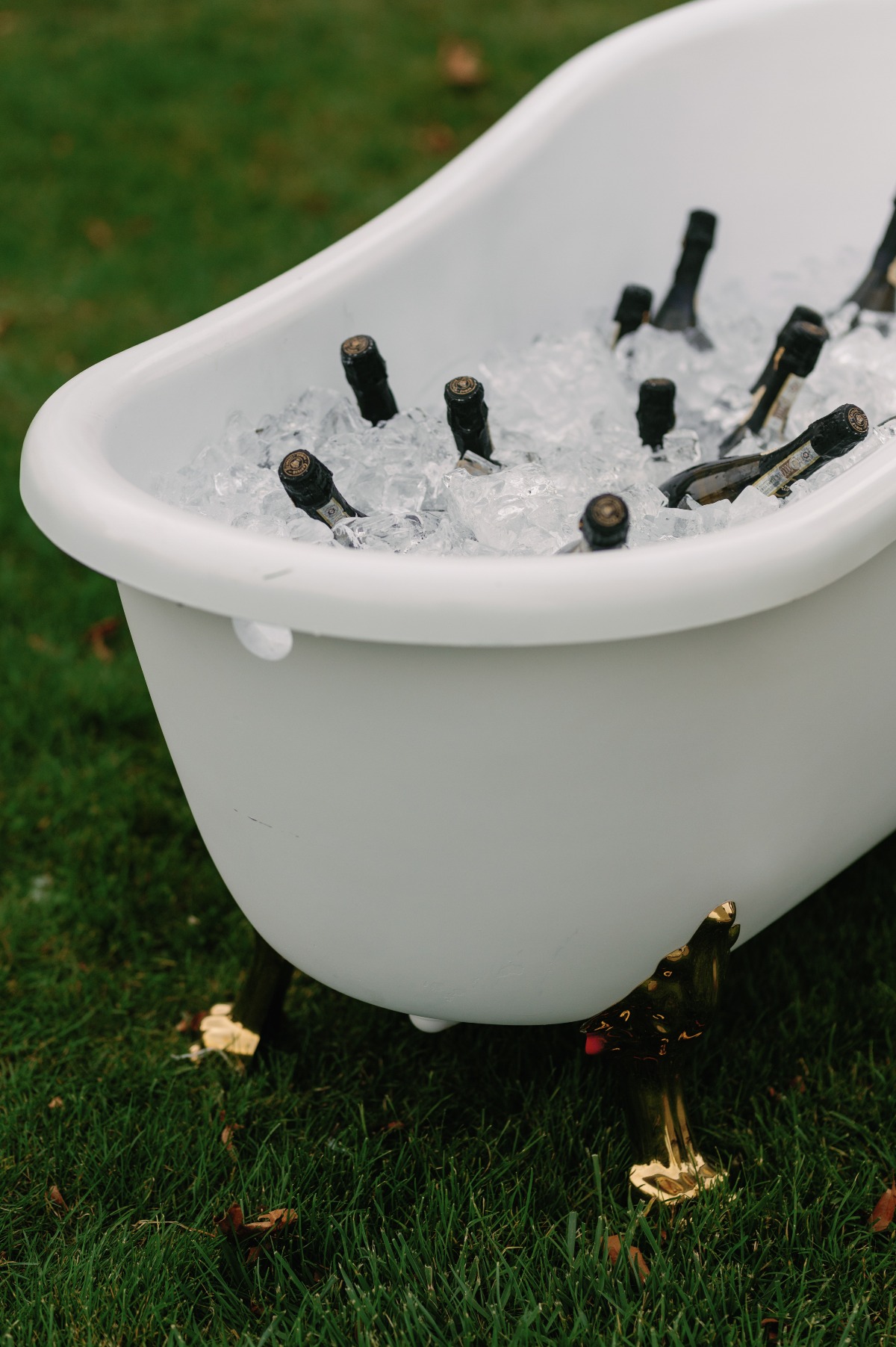 champagne in ice in bathtub