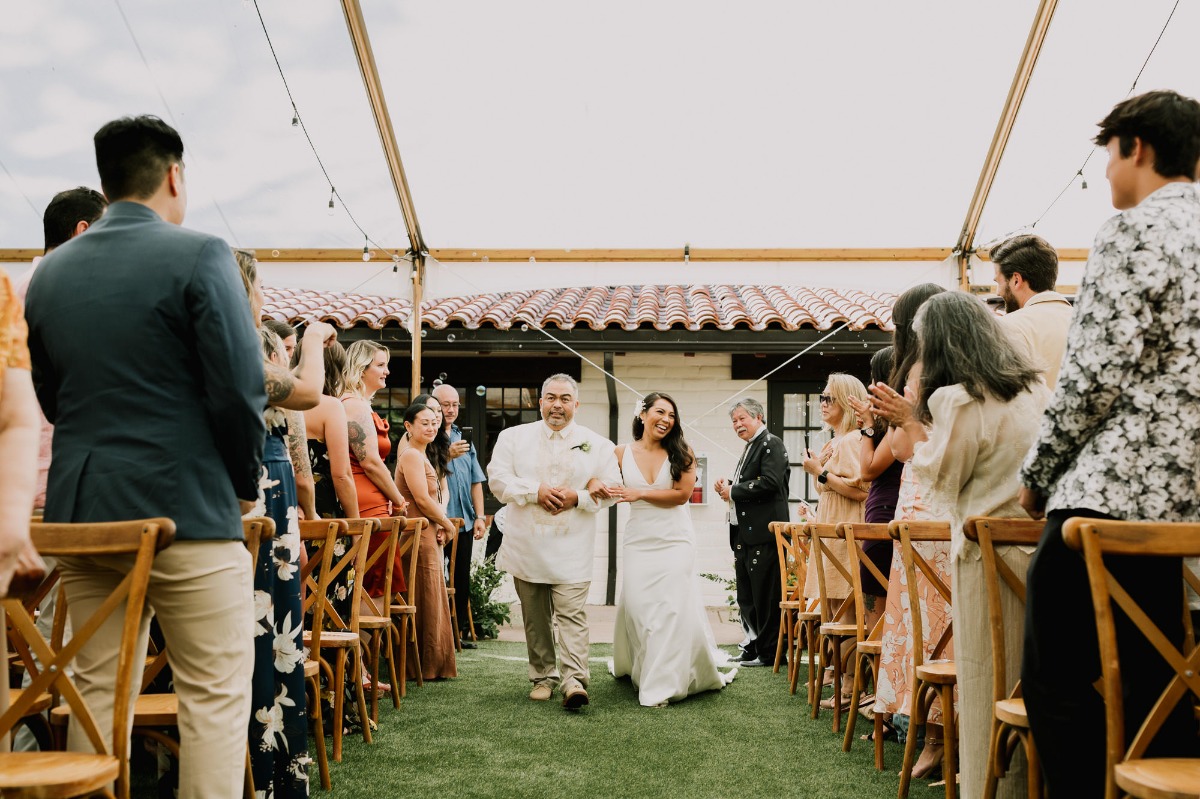 bride and father walking down the asile