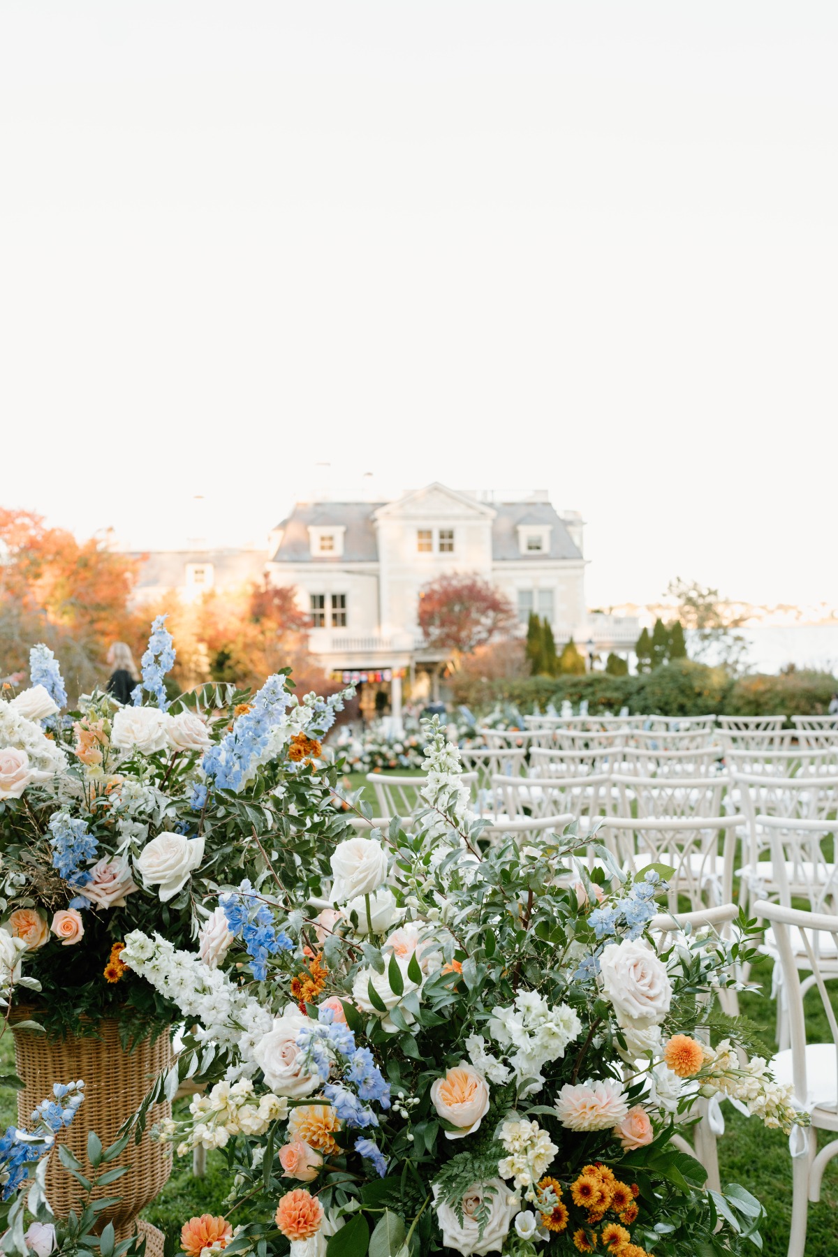 blue peach and orange wedding ceremony flowers