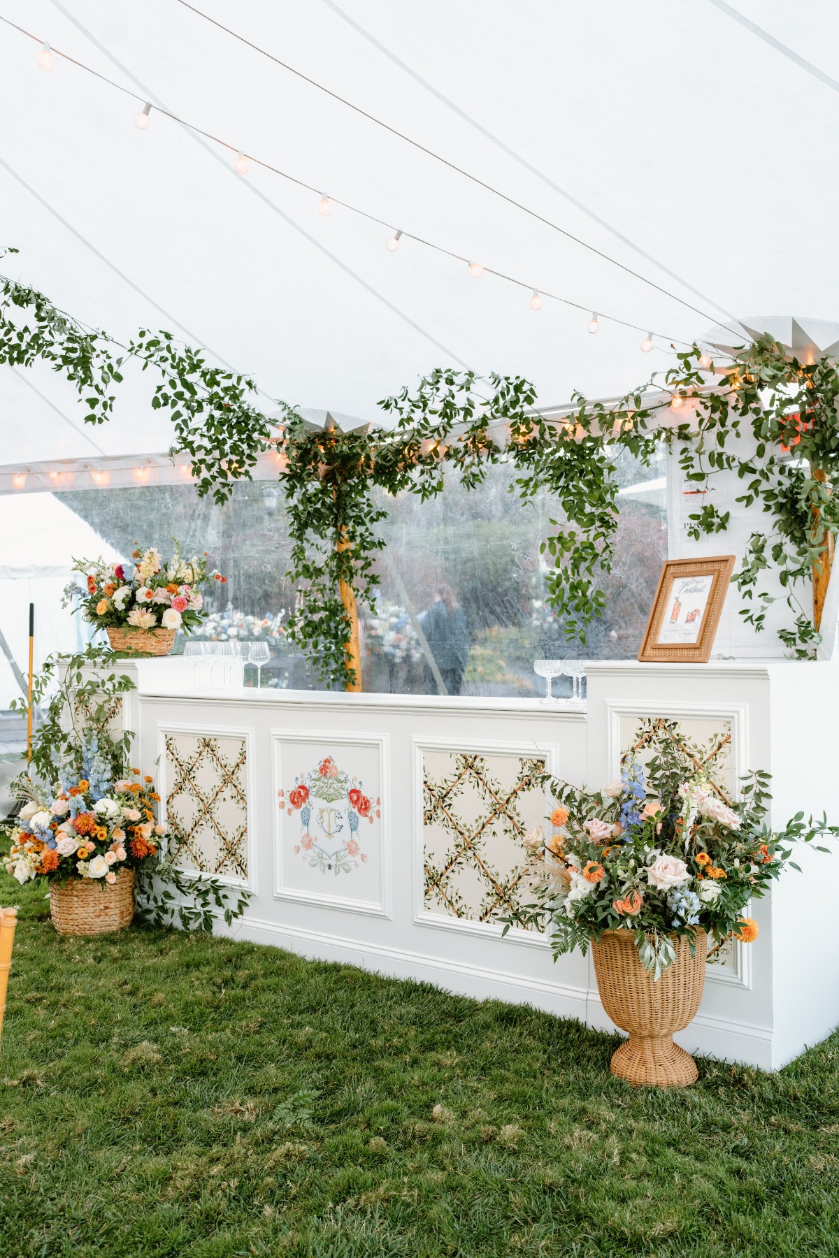 blue white and peach tented bar for wedding