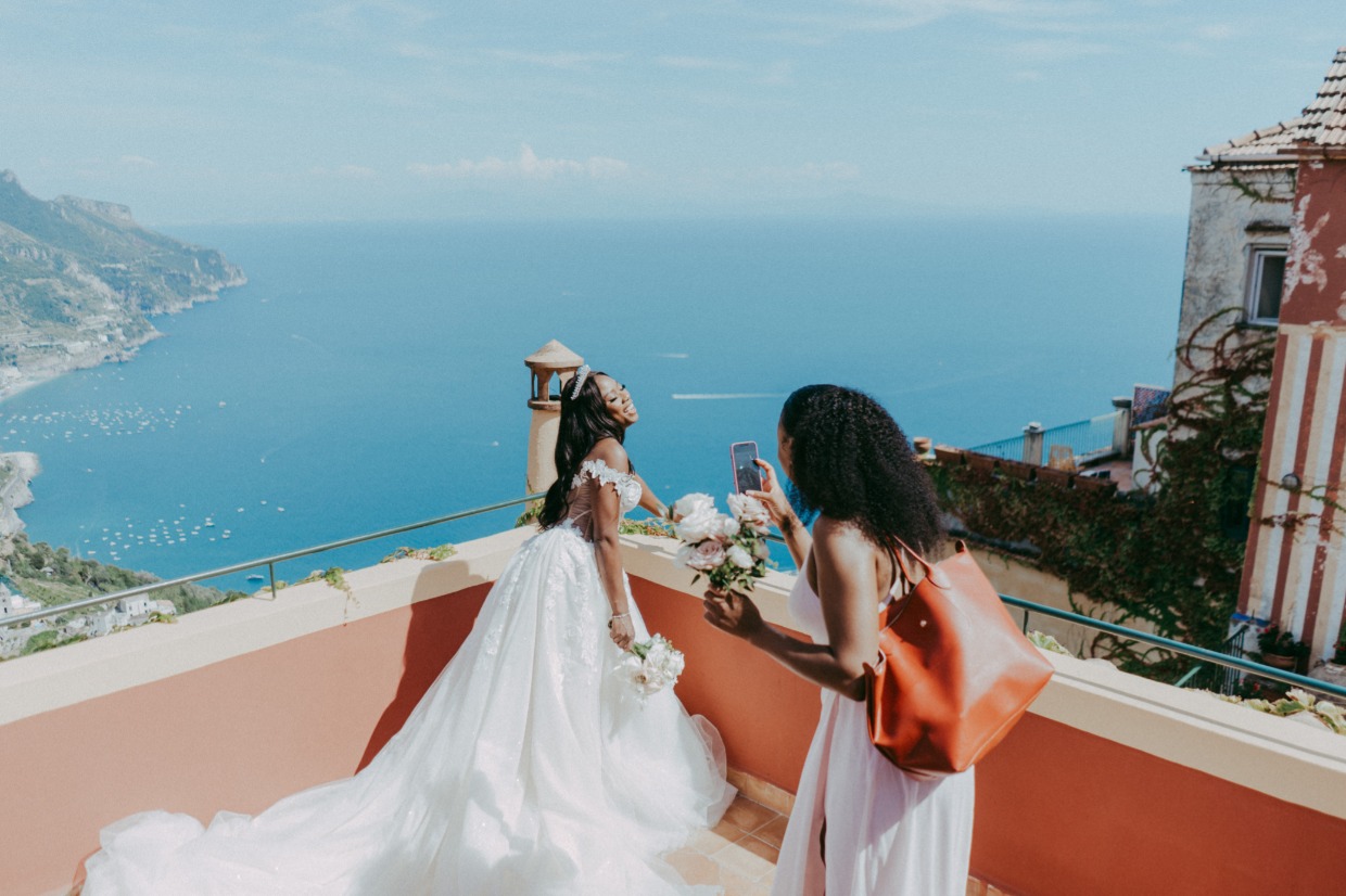 bridesmaid snaps pic of bride in galia lahav euphoria dress