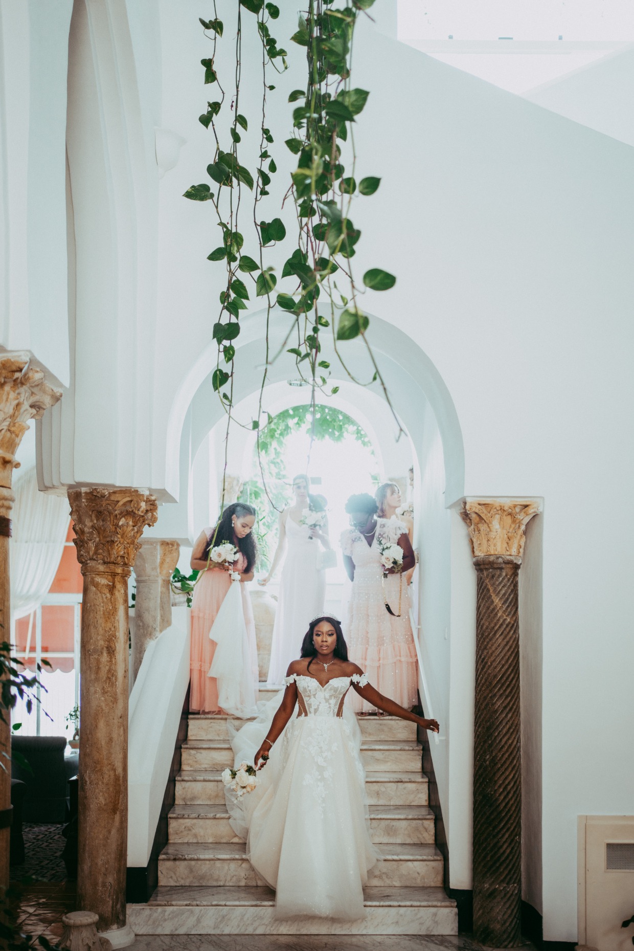 bride walking down stairs in euphoria gown by galia lahav