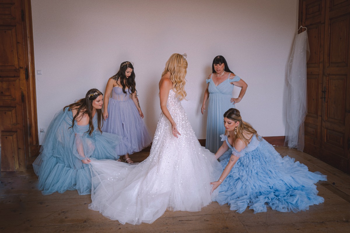 bridesmaids in blue and bride in white