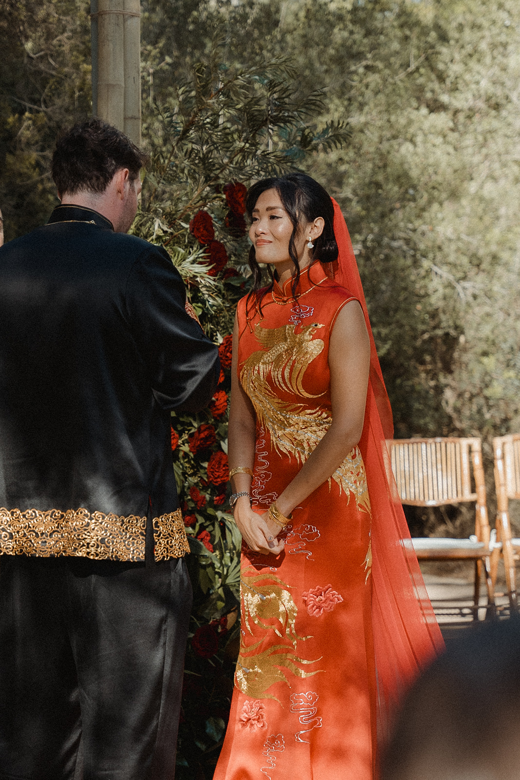 bride in custom red gown by jinza oriental couture