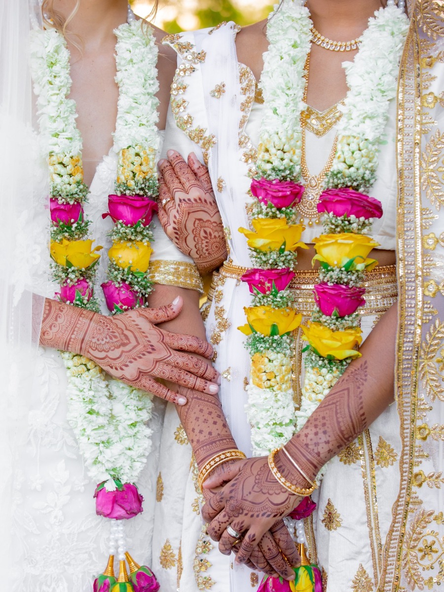 These brides DIY-ed their floral arch and centerpieces