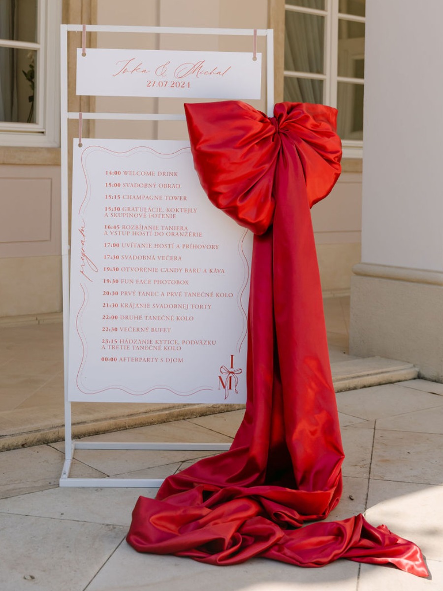 This red and pink castle wedding officially wins the big bow trend