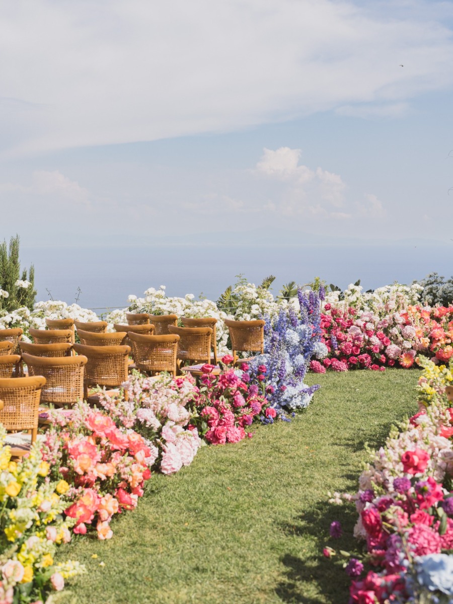 A wedding on the amalfi coast with a rainbow as the color palette