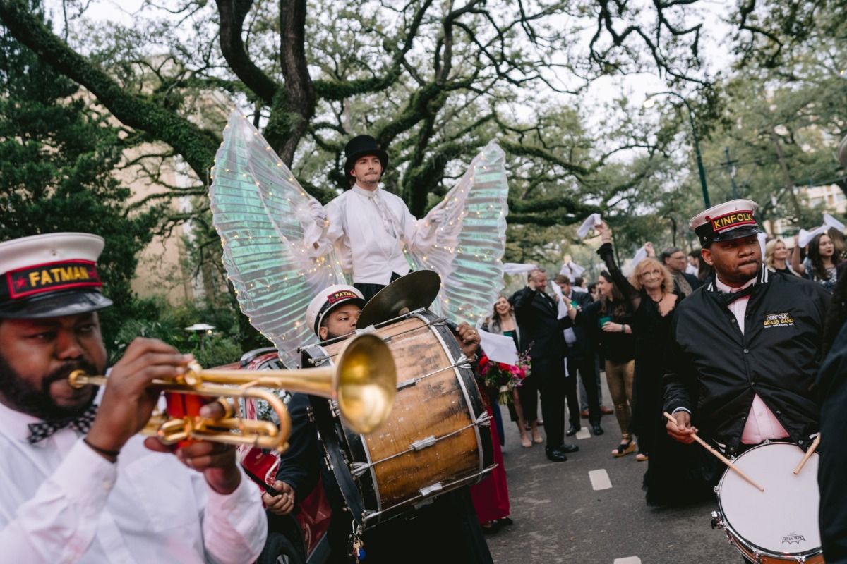 over the top second line in new orleans with stilt performers