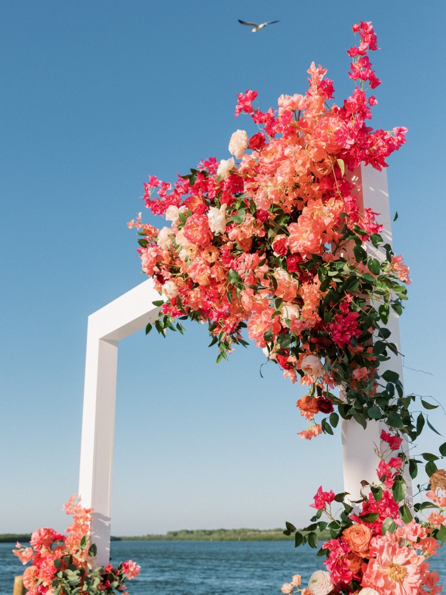 This bougainvillea-inspired wedding was held on a tennis court