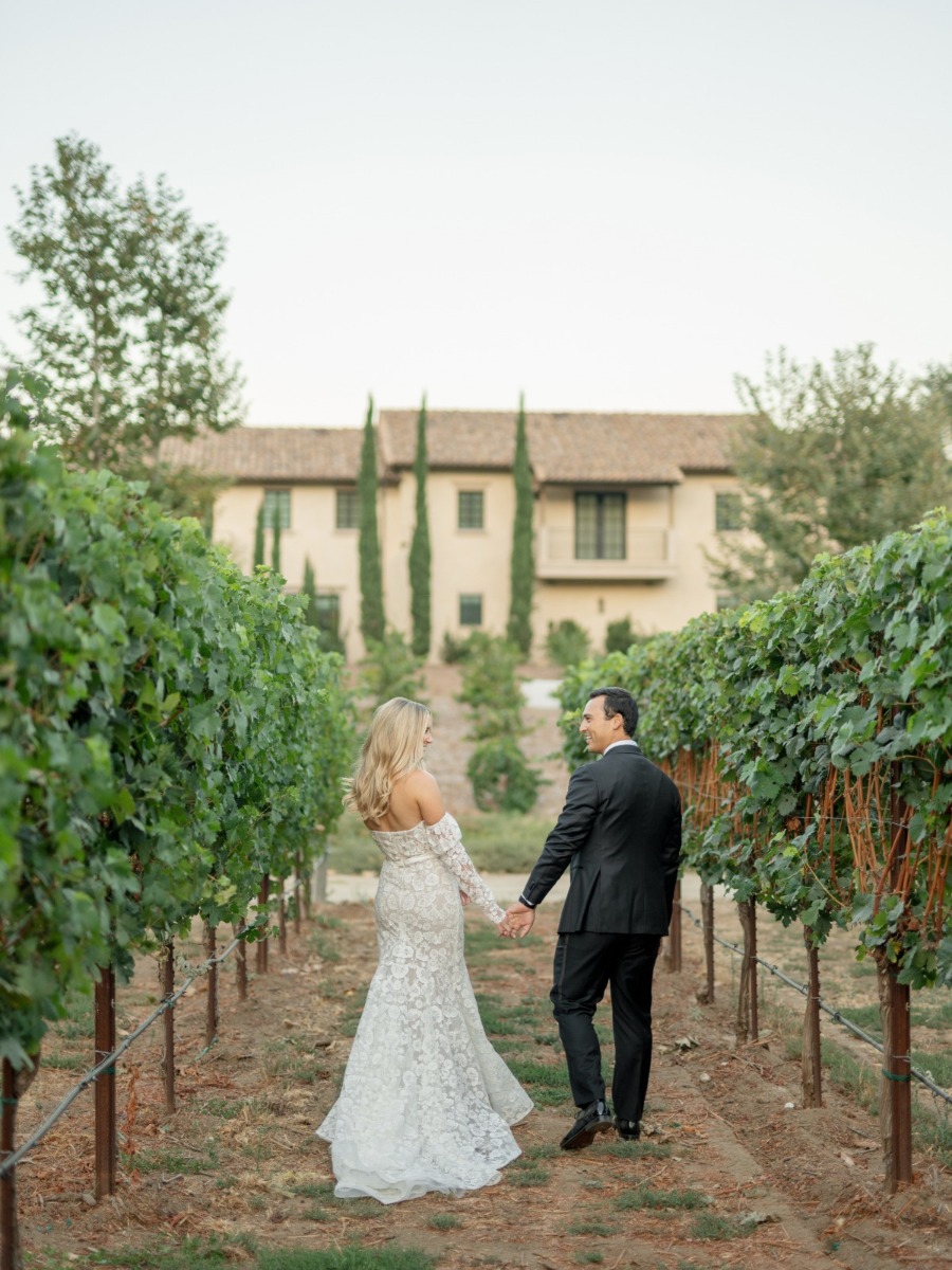 We love the pom-pom exit from this tuscan-inspired vineyard wedding