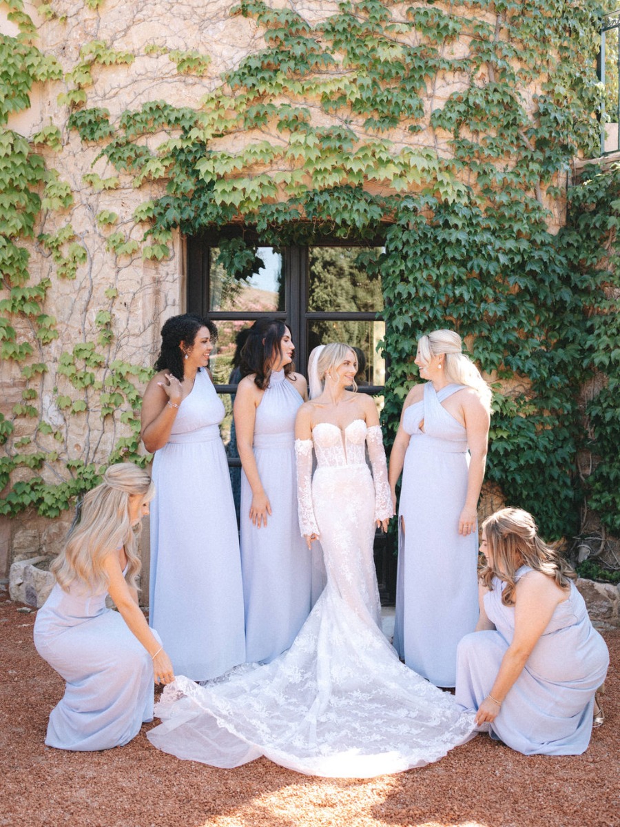 Blue and white wedding on the aegean sea dripping with flowers